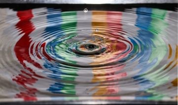 rainbow colours red blue green orange pink blue green ripples in water